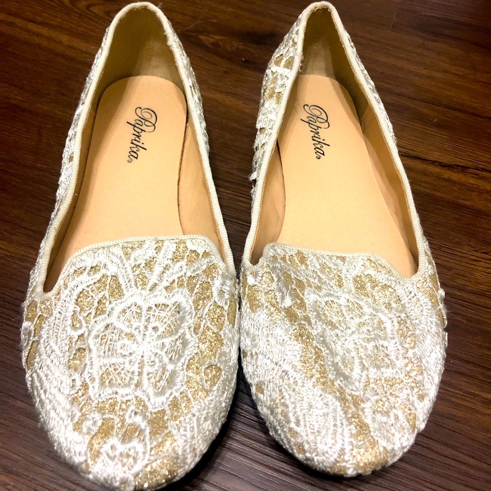 Gold and white flats. Worn a few times. No wear and tear.